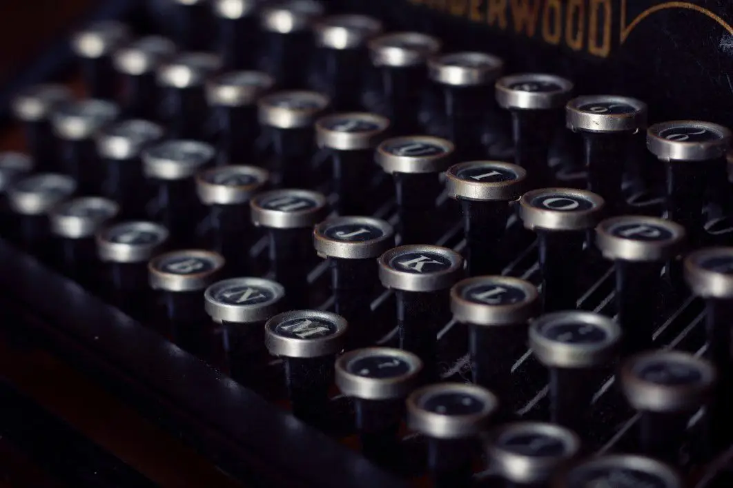 negative-space-closeup-vintage-typewriter-keys-camille-kimberly-thumb-1